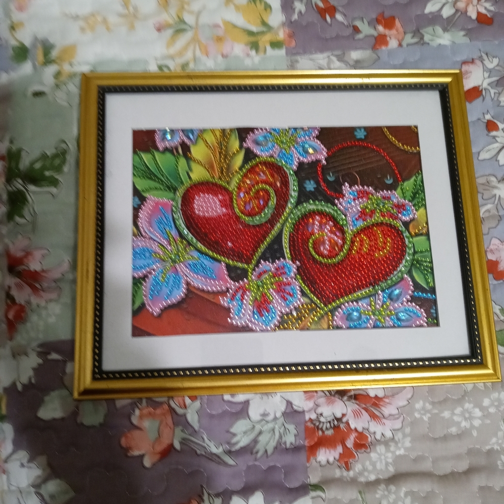 Beautiful picture of love and hearts. Hand made with small glass beads.